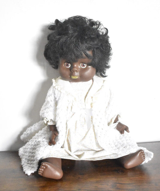 Vintage 1970's Hard Plastic Black Baby Blinking Doll Knitted Cardigan