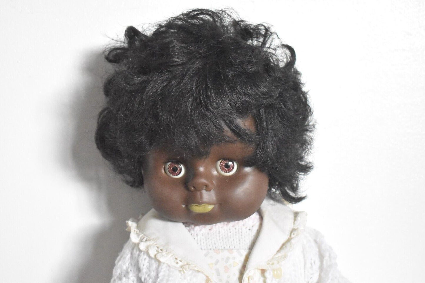 Vintage 1970's Hard Plastic Black Baby Blinking Doll Knitted Cardigan